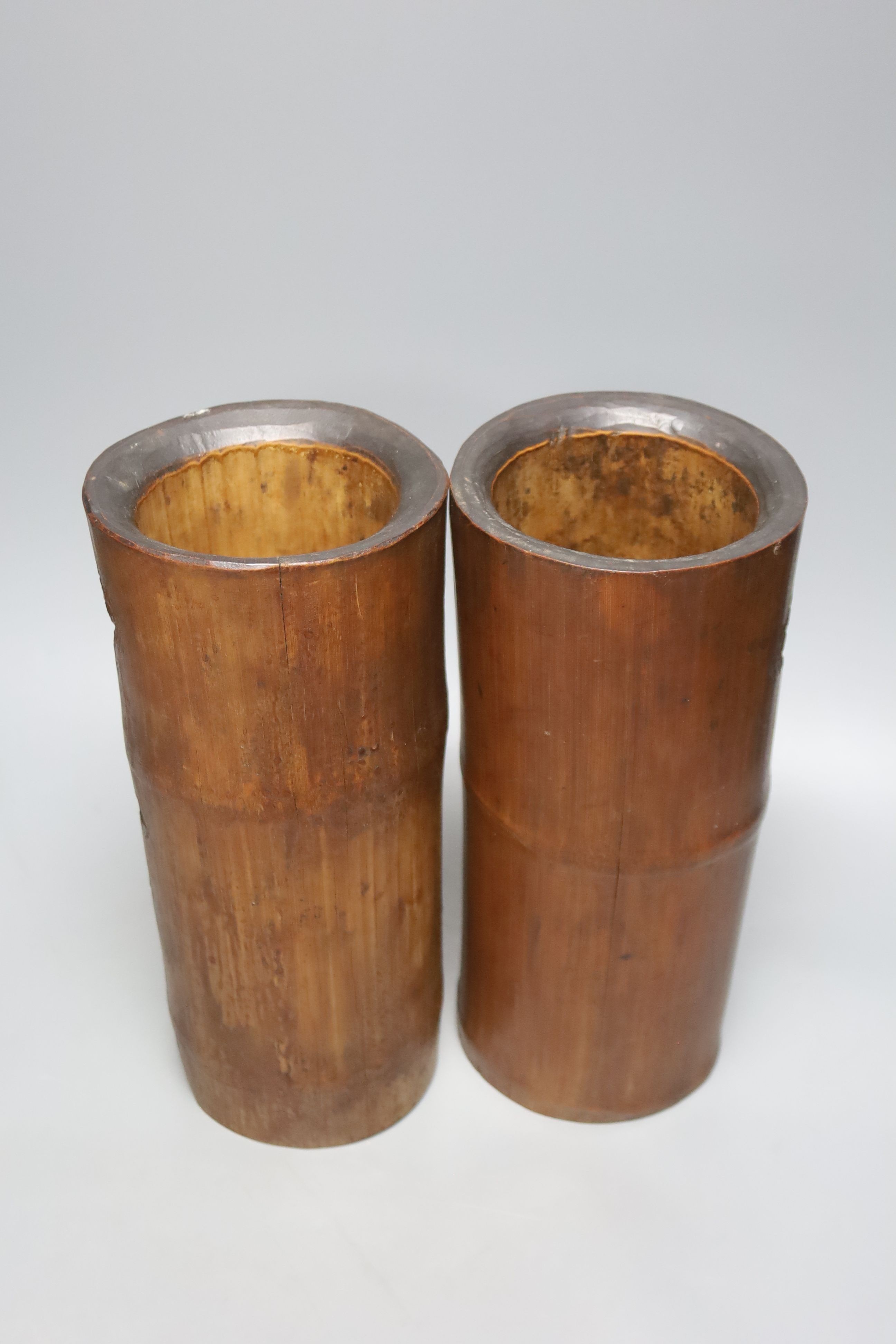 Four Chinese bamboo brushpots and a caddy, tallest brush pot 29 cms high.